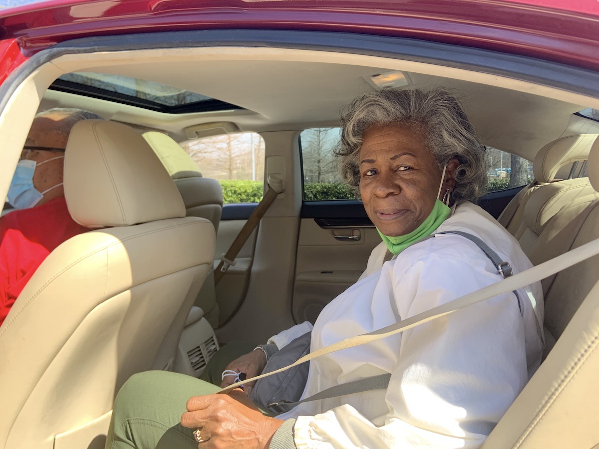 A Fulton County senior prepares to ride home on a trip coordinated by Common Courtesy after receiving her COVID-19 vaccination at Georgia International Convention Center.